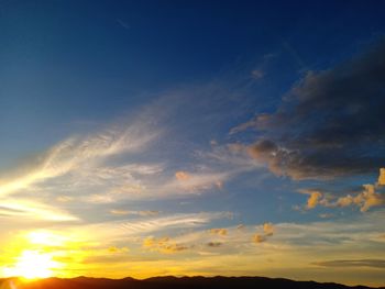 Low angle view of dramatic sky during sunset