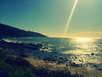 Scenic view of sea against clear sky during sunset