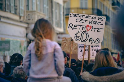 Rear view of people on street