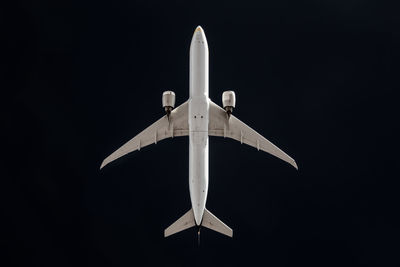 Close-up of airplane against black background