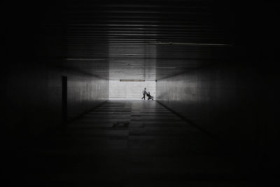 Distant view of woman seen through tunnel
