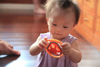 Cute girl holding toy