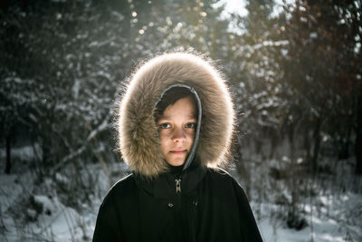 Portrait of boy wearing fur coat