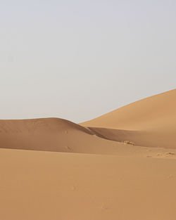 Scenic view of desert against clear sky