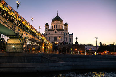 View of bridge over river in city