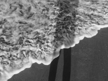 Close-up of man smoking against sky