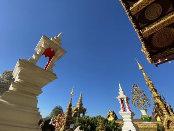 Low angle view of traditional building against clear blue sky