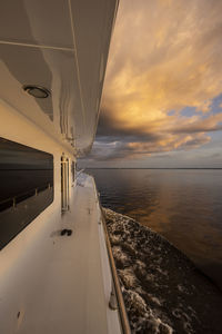 Beautiful colorful amazon sunset from boat over waters of negro river