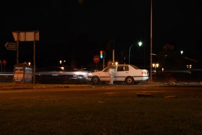 Cars on street at night