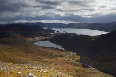 Scenic view of landscape and mountains against sky