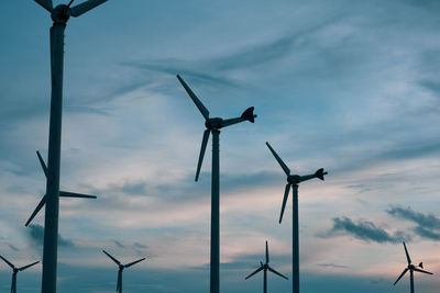 Low angle view of windmill against sky