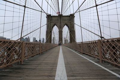 Brooklyn bridge in city against sky