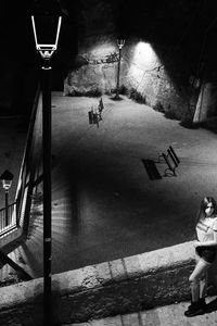 High angle view of people walking on illuminated street