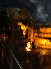 Illuminated railroad tracks by building