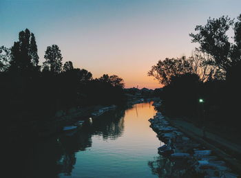 Scenic view of lake at sunset