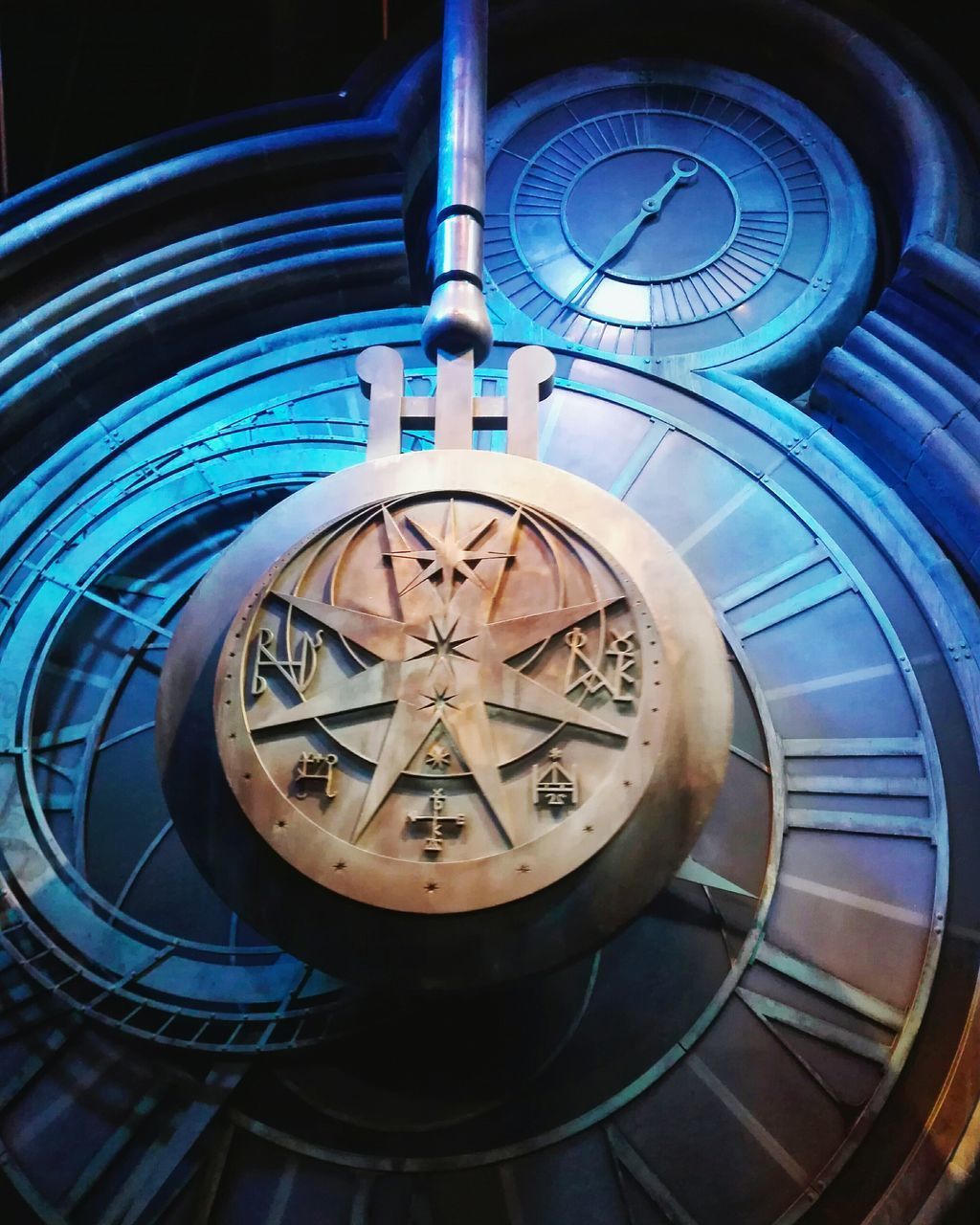 CLOSE-UP OF CLOCK ON BLUE WALL