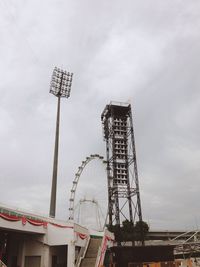 Low angle view of ferris wheel against sky