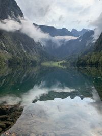 Scenic view of lake and mountains against sky