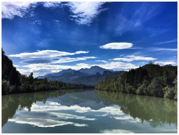 Scenic view of lake against cloudy sky