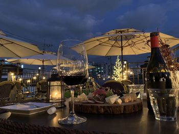 Panoramic view of illuminated restaurant against sky