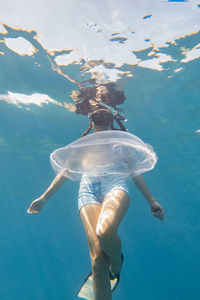 Woman swimming in pool