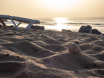 Scenic view of beach against sky during sunset