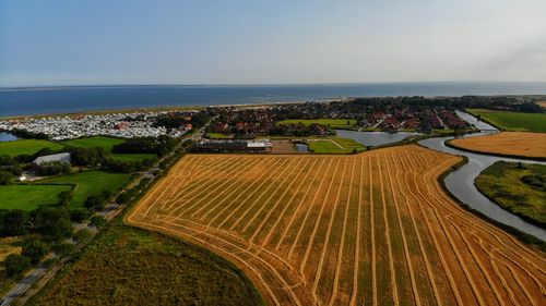 High angle view of sea shore against sky