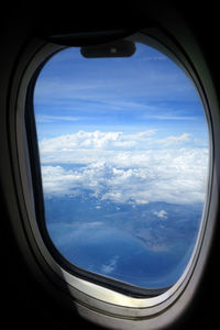 Aerial view of landscape seen through airplane window