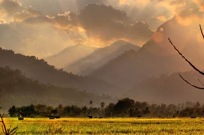 Scenic view of field against sky during sunset