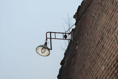 Low angle view of street light against clear sky