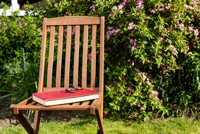 View of red wooden table in garden