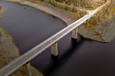 Bridge over the side basin of a dam in a german mountain range, aerial view