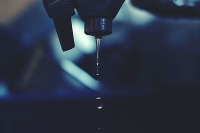 Close-up of water dripping from bottle
