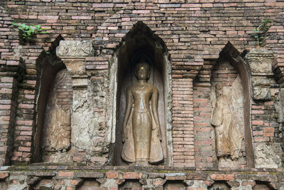 Low angle view of carving on old building