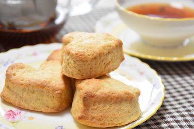 Close-up of scones served in plate on table