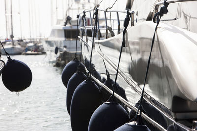 Buoys tied up on boats at harbor
