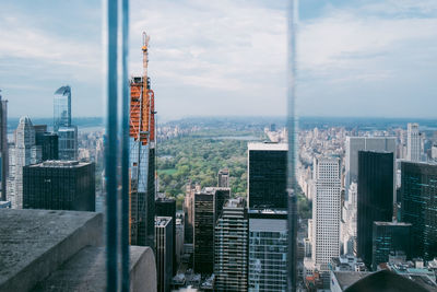 Modern buildings in city against sky