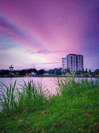 Scenic view of bay against sky at dusk