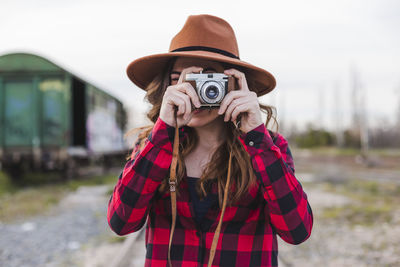 Portrait of woman photographing