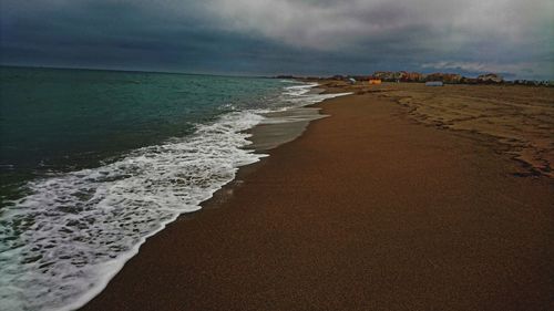 Scenic view of beach against sky