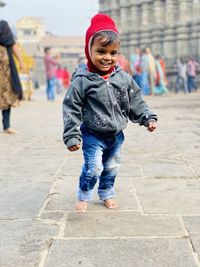 Portrait of boy standing on street