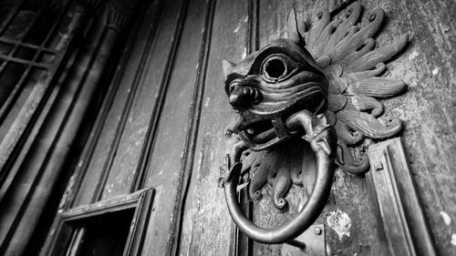 Low angle view of old-fashioned door knocker