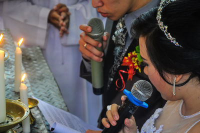 Close-up of couple holding hands