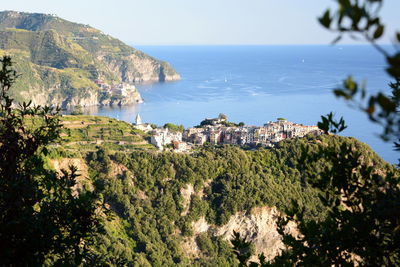 Panoramic shot of townscape by sea against sky