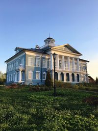 Low angle view of building against clear blue sky