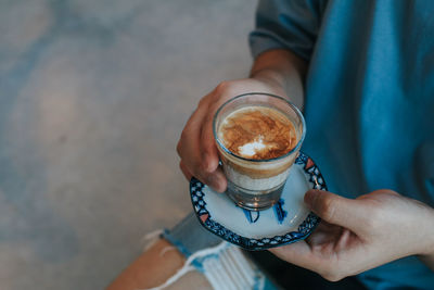 Woman holding coffee cup