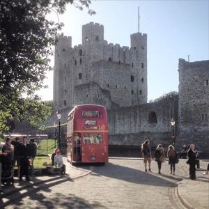 Tourists walking in front of historic building