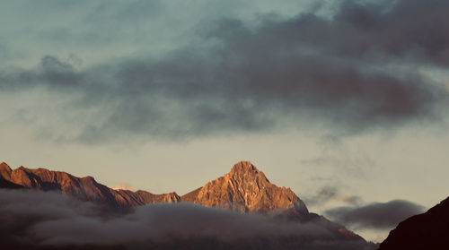 Panoramic view of snowcapped mountains against sky