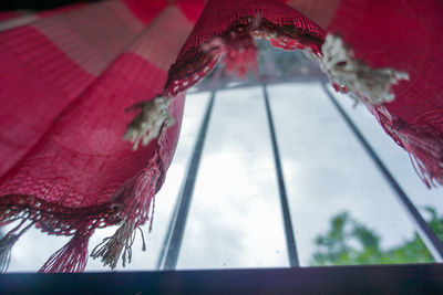 Low angle view of christmas decorations hanging on tree