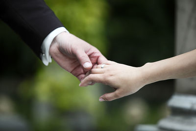 The hands of a bride and a groom